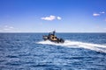 Kythnos Greek island. Speedboat sailing in blue Aegean sea background