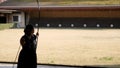 Kyudo practicing bow shooting in Kyoto, Japan. Archery shoot in slowmotion.