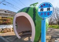 Panel of Tonozaki bus stop in front of the giant watermelon fruit of the Tokimeki Fruit-shaped Bus Stop Avenue.