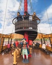 Statue of a pirate on the Boat Mirai of the Kujukushima Pearl Sea Resort with tourists on the crown`s nest.