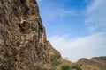 Kyzyl, Tuva - August 15, 2015: Young attractive sexy strong male athlete rock climber climbs