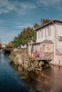 L`Isle-sur-la-Sorgue, Avignon, Vaucluse, Provence-Alpes-Cote d`Azur, France, September 24, 2018: old buildings along t Royalty Free Stock Photo