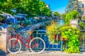 L\'ISLE-SUR-LA-SORGUE, FRANCE, JUNE 24, 2017: Bicycle locked to a railing in the historical center of l\'Isle sur la Sorgue in