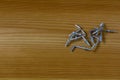 L Shaped Self Tapping Metal Hook on wooden background