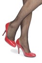 L woman legs tights with red heels over white Royalty Free Stock Photo