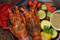 A La Carte Lobster for Seafood Lovers on wood table in black plate