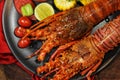 A La Carte Lobster for Seafood Lovers on wood table in black plate