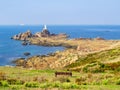 La Corbiere Lighthouse on the rocky coast of Jersey Island Royalty Free Stock Photo