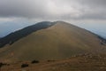 La Covil: a mountain half with trees half naked