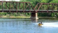 LA CROSSE, WI - 21 JUL 22: Jet skis on Mississippi River near bridge.