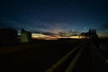 La crosse wisconsin highway 35 Mississippi river bridge at sunset with la crosse brewery silos near the road Royalty Free Stock Photo