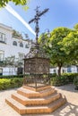 La Cruz de las Sierpes, the Cross of the Serpents, from 1692 sited in the Plaza de Santa Cruz, Saint Cross. Royalty Free Stock Photo