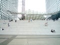 La Defense, Paris,, France, August 20 2018: people sitting and walking on the stairs of the Grand Arch Royalty Free Stock Photo