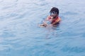 A tourists guide showing a turtle in the sea