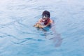 A tourists guide showing a turtle in the sea