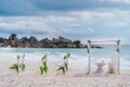 La Digue, Seychelles. Wedding arch gazebo ceremonial decorated with white flowers on a tropical grand anse sand beach