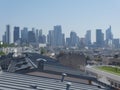 La DÃÂ©fense business district in a blue sky with zinc roofs at the front Royalty Free Stock Photo