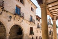 La Fresneda, Spain - July 11, 2021: Shaded atriums and patios between columns along the narrow streets of La Fresneda, Teruel Royalty Free Stock Photo