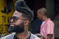 La Havana, Cuba, January 08, 2017: Portrait of a black cuban man with sunglasses on street from la Havana. Afrocaribbean rasta cu Royalty Free Stock Photo