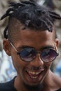 La Havana, Cuba, January 08, 2017: Portrait of a black cuban man with sunglasses on street from la Havana. Afrocaribbean rasta cu