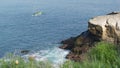 La Jolla, San Diego, CA USA -24 JAN 2020: Group of people on kayaks in ocean, active tourists on canoe paddling and looking for