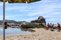 La Maddalena, Sardinia, Italy - Some bathers settle on the free beach of Giardinelli island