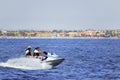 La manga, Murcia, Spain, August 2, 2010: Two senior tourist men enjoying a water scooter ride on a warm summer afternoon