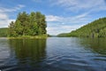 La Mauricie National Park Wapizagonke lake Pine island. Small round island in the middle of a lake. Sunny summer day