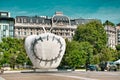 La Mela Reintegrata, The Apple Made Whole Again sculpture in front of the Milano Centrale Railway Station. It is a symbolic work