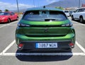 LA OROTAVA, SPAIN - JULY 22, 2023: Peugeot 308 green in an exterior parking, compact and feline design. Car with electric motor,