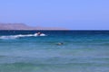 La Paz beach in Mexico. A swimmer and a jet ski. Royalty Free Stock Photo