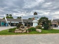 La Pineda, Spain, June 2019 - A building with grass and trees