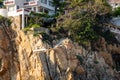 Famous divers wave as they prepare to jump and dive off a tall cliff in Acapulco Mexico