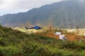 La Reunion Island - Helicopter winching goods to Mafate cirque Royalty Free Stock Photo