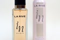 La rive IN woman deodorant and perfume bottles on beige background. LA RIVE S.A. is one of the leading producers of perfumes and Royalty Free Stock Photo