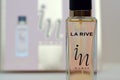 La rive IN woman deodorant and perfume bottles on prefume box background. LA RIVE S.A. is one of the leading producers of perfumes Royalty Free Stock Photo