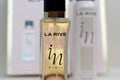 La rive IN woman deodorant and perfume bottles on prefume box background. LA RIVE S.A. is one of the leading producers of perfumes Royalty Free Stock Photo