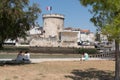 La Rochelle , Aquitaine / France - 11 19 2019 : entrance harbour towers of the old port in La Rochelle in France