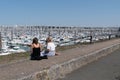 La Rochelle , Aquitaine / France - 11 19 2019 : port des minimes two young woman look boat in summer day