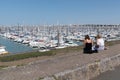 La Rochelle , Aquitaine / France - 11 19 2019 : yacht and two girls sit in port Minimes harbor La Rochelle harbour in france