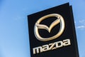 La rochelle, France - August 30, 2016: Official dealership sign of Mazda against the blue sky. Mazda Corporation is a Japanese aut