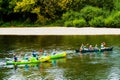 LA ROQUE GAGEAC, FRANCE - AUGUST 09, 2018: Tourists with children have fun kayaking on the Dordogne River. Three kayaks in Royalty Free Stock Photo