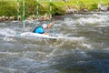 Unidentified sportsman struggling with the flow. in La Seu d`Urgell, Catalonia. Parc Olimpic del Segre