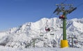 Chairlift at snow covered Italian ski area in the Alps - winter sports concept with copy space Royalty Free Stock Photo