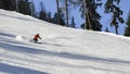 Sole skier down a piste at high speed