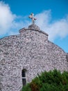 LA TOJA, SPAIN - JULY 24, 2021:Facade of Ermida de San Campio e San Sebastian shrine covered with scallop shells at the La Toja