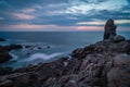 La Torche at dusk long exposure photo of rocks and sea Royalty Free Stock Photo