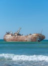 Laayoune port, Morocco, Western Sahara - January 6, 2019: a rusty ship was wrecked in the Ocean. Copy space. Vertical