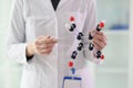 Lab assistant demonstrates molecule model close view