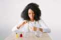 Lab assistant testing water quality. Portrait of a young beautiful African American girl researcher chemistry student Royalty Free Stock Photo